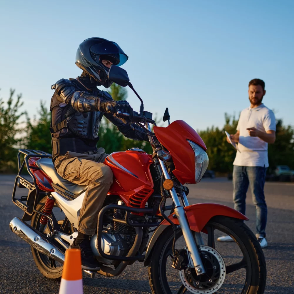 male-student-motorbike-instructor-riding-cones-lesson-motorcycle-school-training-motorcyclists-begin